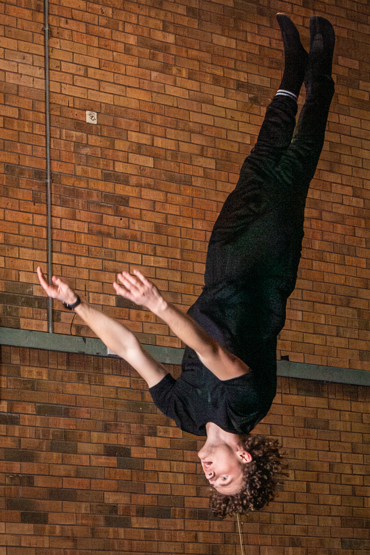 A gymnast mid-flip during a trampolining session at Trafford Trampoline Club